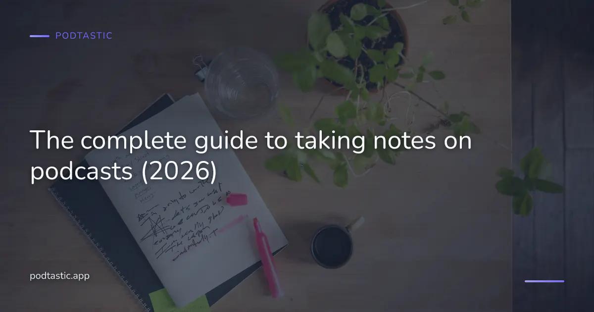 A notebook and pen next to a phone playing a podcast on a wooden desk